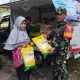 Babinsa Koramil Rogojampi Dampingi Pasar Murah Bulog, Bantu Penuhi Kebutuhan Sembako Warga